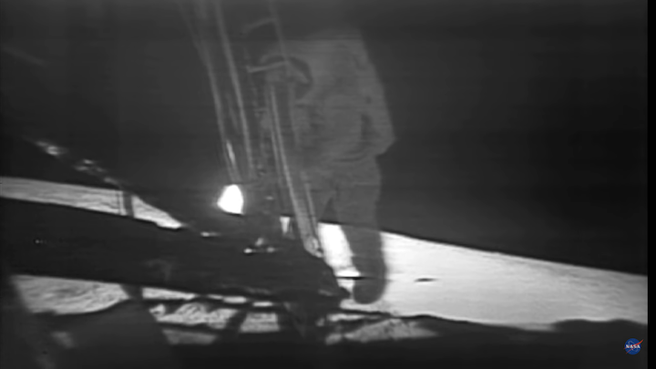 Neil Armstrong taking his first step on to the moon